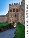 Stone tower leading to the medieval citadel castle of the monumental city of Trujillo, Spain.