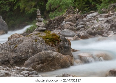 stone tower on a rock in the torrent