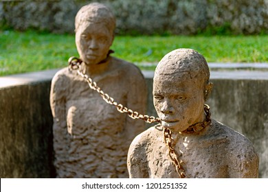 Stone Town, Zanzibar - 24 September, 2013: Monument of slaves in Stone Town, Zanzibar. Historical Memorial with sculptures and chains near the former african slave trade place in slave market.