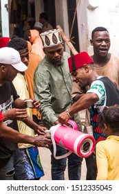 Stone Town, Zanzibar / Tanzania - September 14th 2019: Swahili Man In Costume Offering Coffee In The Street Of Stone Town, Zanzibar. 