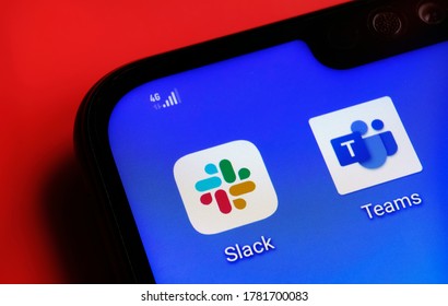 Stone / United Kingdom - July 22 2020: Slack And Microsoft Teams Apps On The Corner Smartphone Screen Placed On Red Background. Concept For Competition.