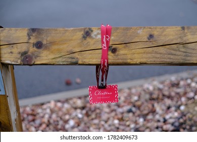 Stone / United Kingdom - July 22 2020: Lost Clintons Store Manager Badge Seen On The Fance Street Photo Clintons Is A Chain Selling Seasonal And Special-occasion Cards, Gifts And  Party Goods.