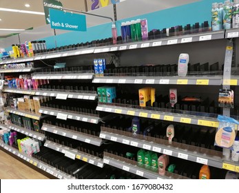 Stone, United Kingdom - March 21 2020: Empty Supermarket Shelves. Aisle With Shampoo And Soap. Coronavirus Panic Buying At Morrisons Supermarket, Staffordshire, UK.