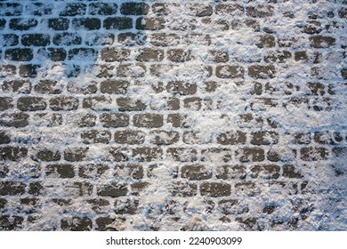 Stone urban pavement is covered with frosty snow and ice. Winter background of frozen tiled sidewalk. - Powered by Shutterstock