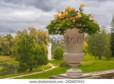 Stone vases with flowers in Pavlovsky Park, Russia St. Petersburg