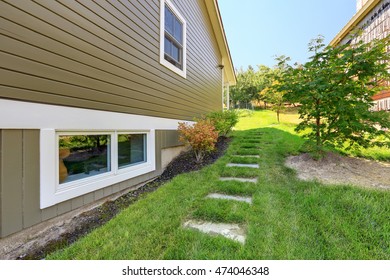 Stone Walkway On Green Grass Leading To The Backyard. Northwest, USA