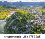 The stone wall of the ancient fortress in Qingyan Ancient Town, Guizhou province, China, aerial background during sunset