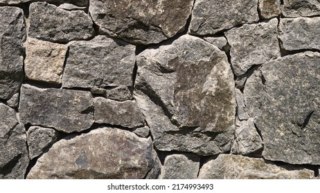Stone wall background, grey masonry, stonework tecture