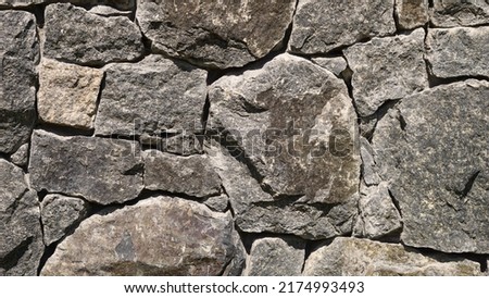 Stone wall background, grey masonry, stonework tecture