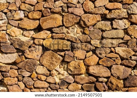 Stone wall. Brown background texture