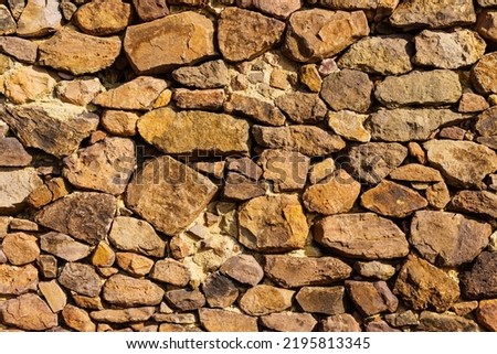 Stone wall. Brown background texture
