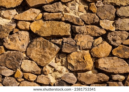 Stone wall. Brown background texture