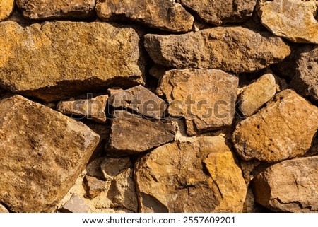 Stone wall. Brown background texture