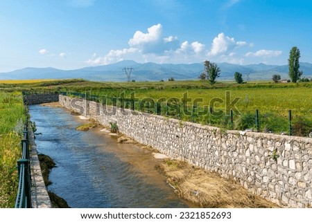 Stone wall built on the edge of the stream to protect from flooding (Taskin koruma in Turkish) Stock fotó © 