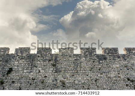 Stone wall of the castle and the contrasting sky.