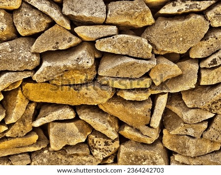 Stone wall construction is both laborious and beautiful.