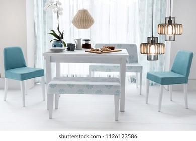 stone wall and dining table and design chairs, home, office and hotel interior design