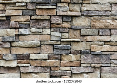 The stone wall texture background natural color. Background of stone wall texture photo. Natural stone wall texture for background. Old Brick  texture, Grunge brick wall background.