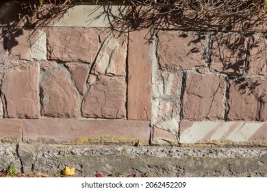 Stone wall texture for backgrounds. Yellow and red stone on the wall