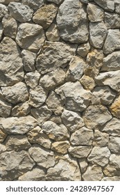 Stone wall yellowish grey background detail texture closeup full frame