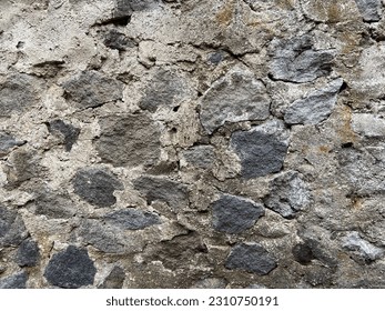 the stone walls look worn with age - Shutterstock ID 2310750191