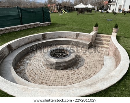 Stone wood fireplace with concrete benches