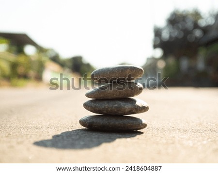 Stone Zen Stack Balance Abstract blur Leaf Background Stability Spa Pyramid Pebble Group Peace Overlay Sunshine nature, Meditation Natural Harmony Aroma Outdoor Relaxtion Massage Japan Health Word.