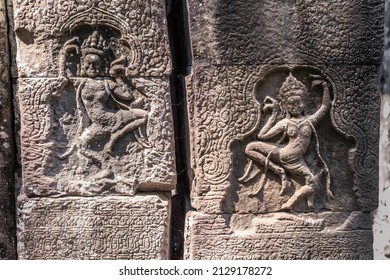 A stone-carved bas-relief depicting dancing apsaras on a column of a Cambodian temple in the Angkor complex, Siem Reap, Cambodia