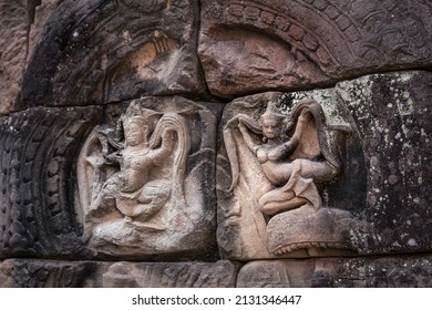 A stone-carved bas-relief depicting dancing apsaras on a column of a Cambodian temple in the Angkor complex, Siem Reap, Cambodia