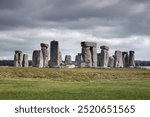 Stonehenge in England beneath a cloudy sky.