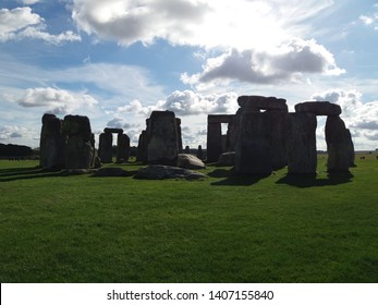 Stonehenge In Light With Clouds Above.