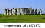 Stonehenge, Wiltshire, United Kingdom, August 29, 2024. Atmospheric ancient prehistoric neolithic stone circle or monument Focus on outer Sarsen stone circle. Outdoors on a sunny summer day