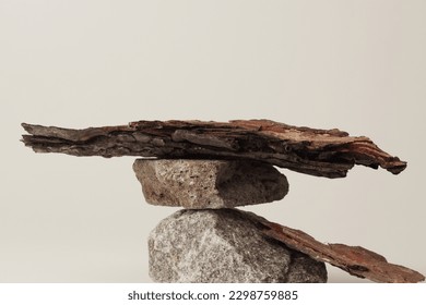 Stones and  bark of tree platform podium on beige light copy spase background. Minimal empty display product presentation scene. - Shutterstock ID 2298759885