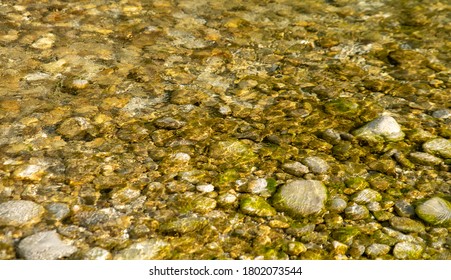 stones in the clear water of a mountain river - Shutterstock ID 1802073544