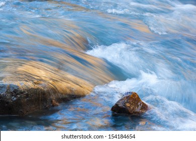 Stones In The Flowing River