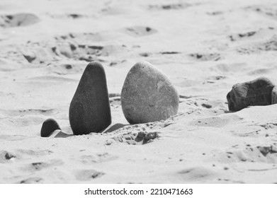 stones on a sandy beach 