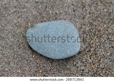 Similar – Beautiful hand holding a stone, on a beach sand background.