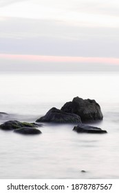 Stones In The Sea On A Long Exposure. Portrait Capture