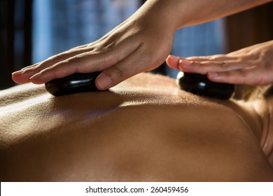 Stone-therapy massage close-up.