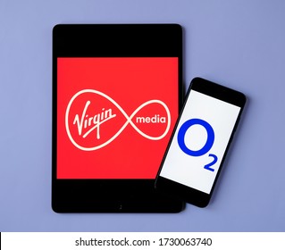 Stone/UK-May 12 2020: Virgin Media And O2 Telefonica Logos On The Mobile Devices. Concept For Potential Merger Of The Two Telecom Companies.