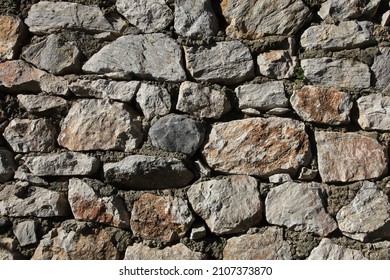 Stonewall. A stone wall made using concrete. Close up background.