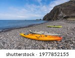 Stoney beach cove with kayaks near Scorpion Ranch on Santa Cruz Island in Channel Islands National Park near Los Angeles and Ventura, California, USA.  