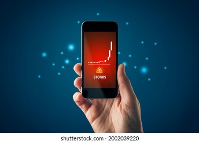 Stonks (meme Stock) Investment Warning Concept With Smart Phone. Soaring Graph Of Stock Or Cryptocurrency And Notification About Stonks Hazardous Investment, Risk And Threat.