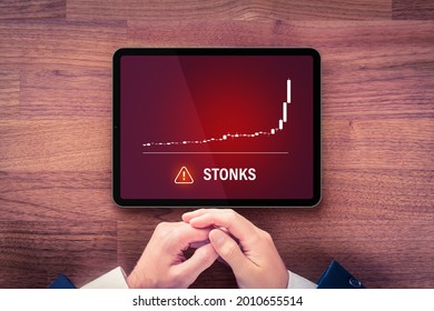 Stonks (meme Stock) Investment Warning Concept With Digital Tablet. Soaring Graph Of Stock Or Cryptocurrency And Notification About Stonks Hazardous Investment, Risk And Threat.