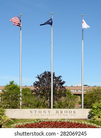 STONY BROOK, NY - MAY 24, 2015: Stony Brook University Main Entrance. The Flags At The SUNY Institution At Stony Brook, Long Island, New York.