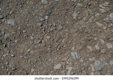 Stony Desert Soil Texture. Gray Dry Ground With Small Stones. Close-up From Above