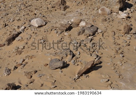 The stony soil of the desert on the Sinai Peninsula in Egypt. Arabian Desert. Archeology. Stones. Bad soil. Martian soil. Mars surface.