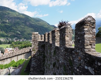 Stony walls of castle in european Bellinzona city in canton Ticino in Switzerland, clear blue sky in 2017 warm sunny summer day on July.