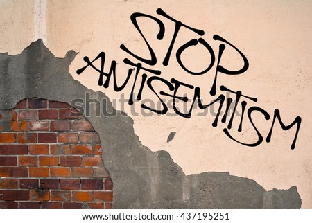 Stop Antisemitism - handwritten graffiti sprayed on the wall, anarchist aesthetics. Appeal to fight against religious prejudice, hatred, violent attacks and genocide