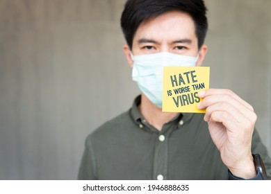 Stop Asian Hate Support Asian Americans Communities Campaign. A Handsome Young Asian Man With Face Mask Hold A Note Say 